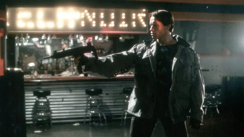 Arnold Schwarzenegger with an Uzi