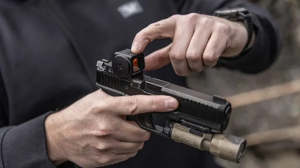 The Venom Enclosed Micro Red Dot has two button on top.